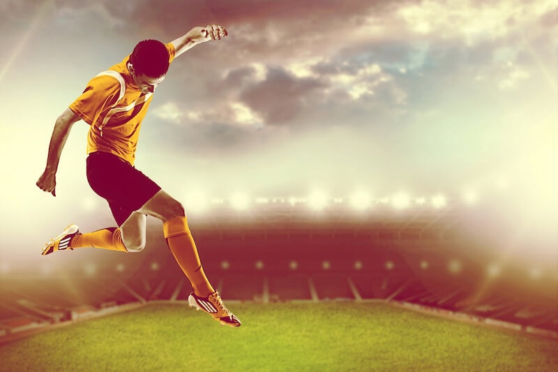 Carta Da Parati Calciatore Su Sfondo Verde Campo - Fotomurale